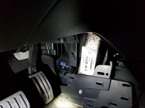 Cold weather fuse box in the driver footwell