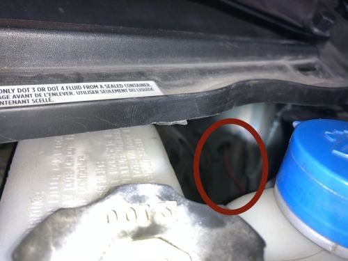 Wire routed toward the firewall gasket