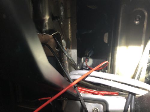 Cabin side of the gasket behind the driver kneeboard